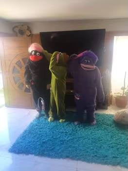 Three friends wearing Silly Onesies together